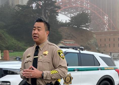 Sheriff Miyamoto stands at Fort Point near Golden Gate Bridge
